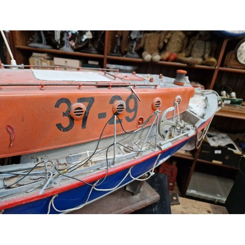 72 - A model lifeboat on stand, approx. 95cm long