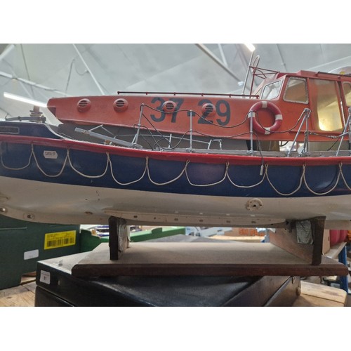 72 - A model lifeboat on stand, approx. 95cm long