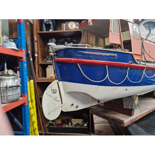 72 - A model lifeboat on stand, approx. 95cm long