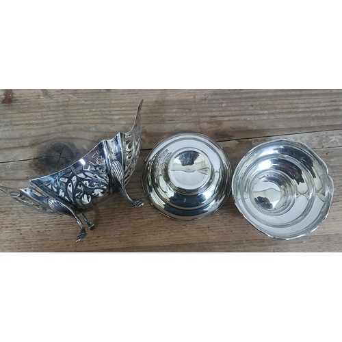 506 - A hallmarked silver pierced bon bon dish and a pair of hallmarked silver pin dishes, weight 127.5g.