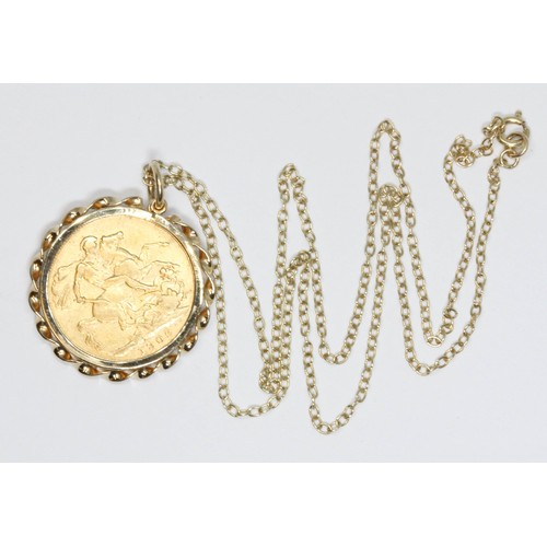 510 - An Edward VII 1909 sovereign, yellow metal mount unmarked, suspended on 44cm chain, bolt ring clasp ... 