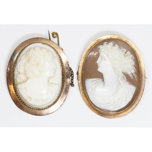 516 - Two 9ct gold mounted cameo brooches, length 36mm & 38mm, gross weight 15.7g.