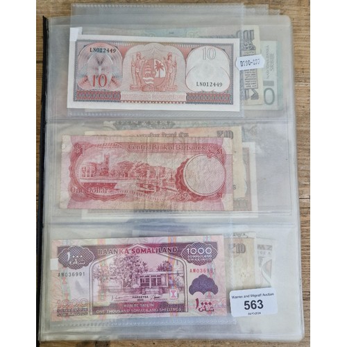 563 - A file of assorted world banknotes.