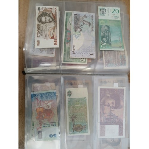 563 - A file of assorted world banknotes.