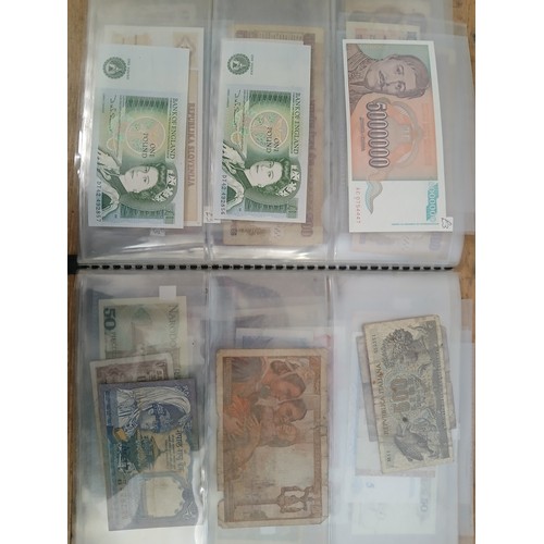 563 - A file of assorted world banknotes.