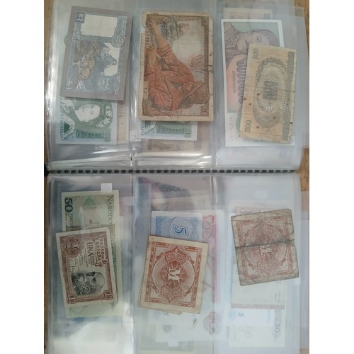 563 - A file of assorted world banknotes.