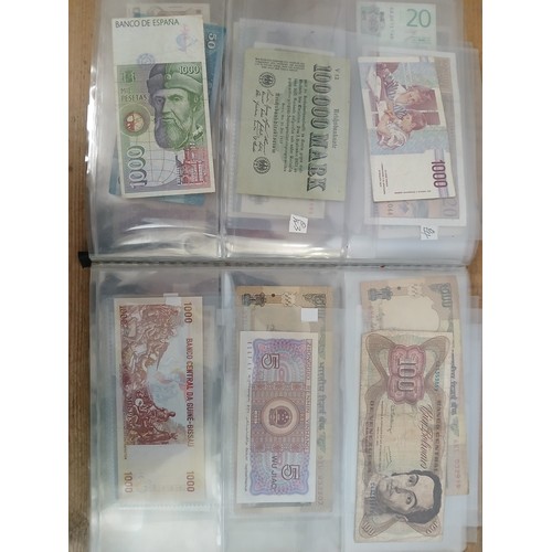 563 - A file of assorted world banknotes.