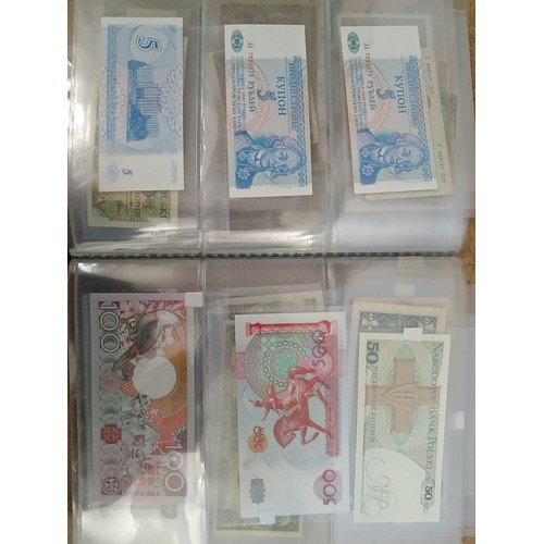 563 - A file of assorted world banknotes.