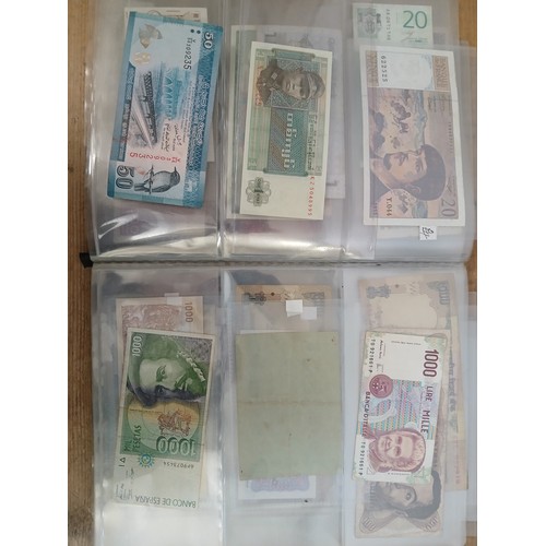 563 - A file of assorted world banknotes.