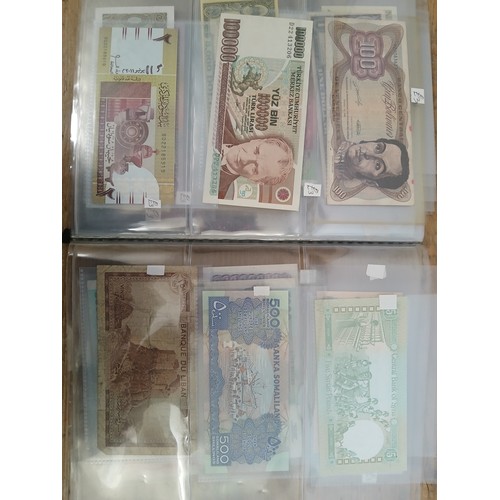 563 - A file of assorted world banknotes.