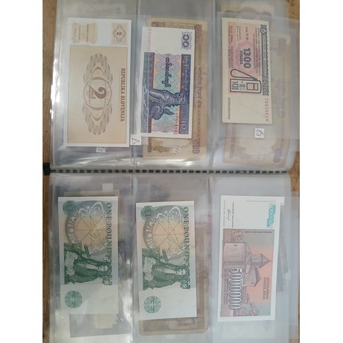 563 - A file of assorted world banknotes.