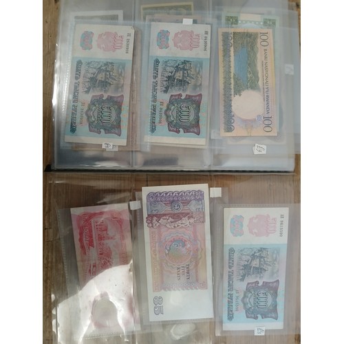 563 - A file of assorted world banknotes.