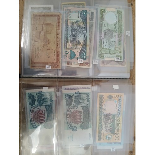 563 - A file of assorted world banknotes.