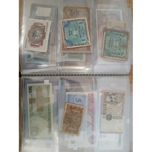 563 - A file of assorted world banknotes.