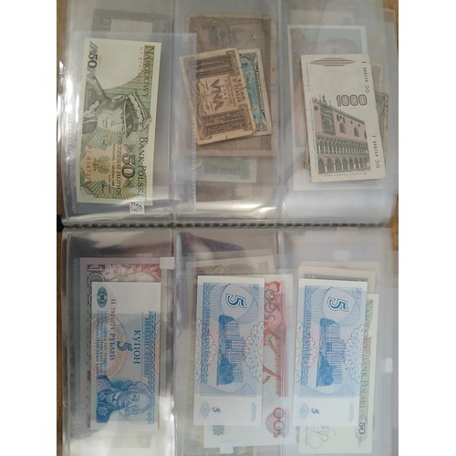 563 - A file of assorted world banknotes.