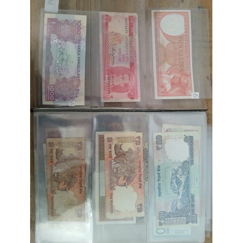 563 - A file of assorted world banknotes.