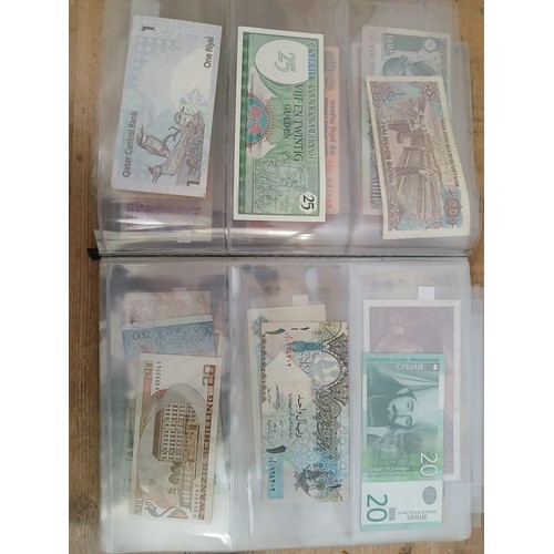 563 - A file of assorted world banknotes.