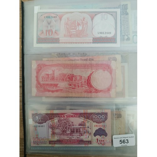 563 - A file of assorted world banknotes.