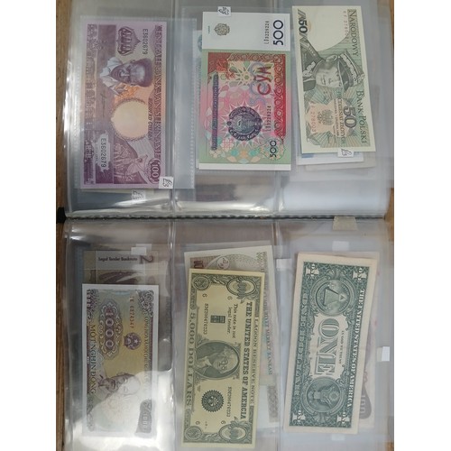 563 - A file of assorted world banknotes.