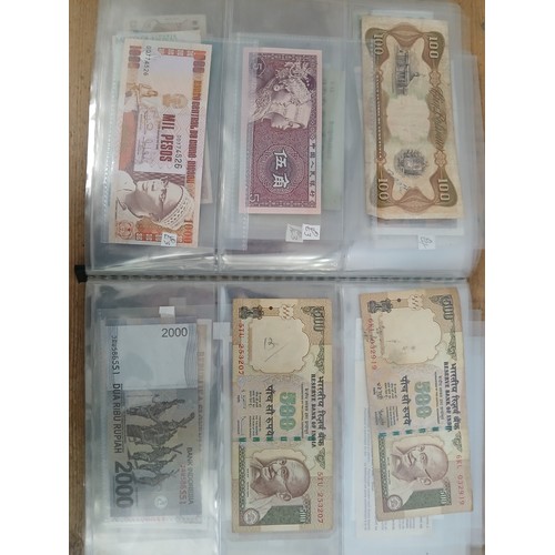 563 - A file of assorted world banknotes.