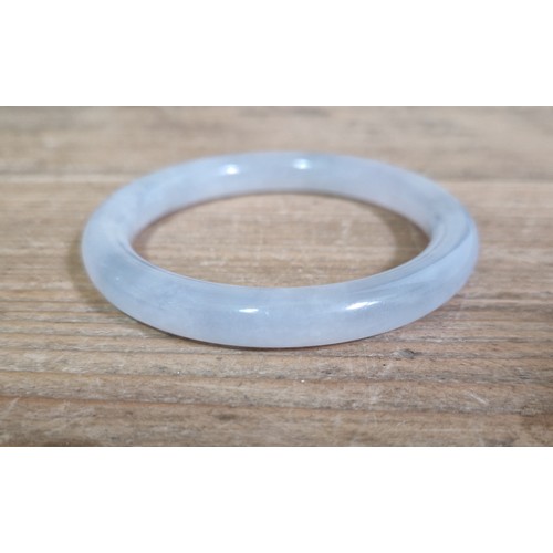 185 - A Chinese icy jadeite jade bangle, inner diameter 55mm, outer diameter 74mm, gross weight 44.4g.