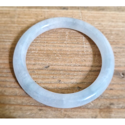 185 - A Chinese icy jadeite jade bangle, inner diameter 55mm, outer diameter 74mm, gross weight 44.4g.