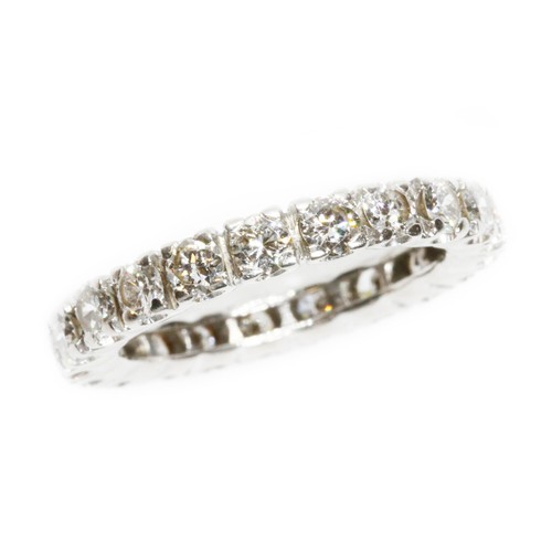 592 - A diamond eternity band, twenty one round brilliant cut diamonds weighing approximately 1.68cts in t... 