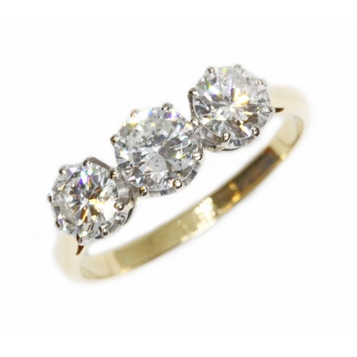 591 - A three stone diamond trilogy ring, the round brilliant cut stones weighing approximately 0.37, 0.48... 