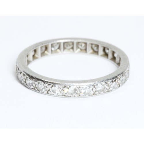 593 - An early to mid 20th century diamond eternity band, twenty three single cut stones weighing approxim... 