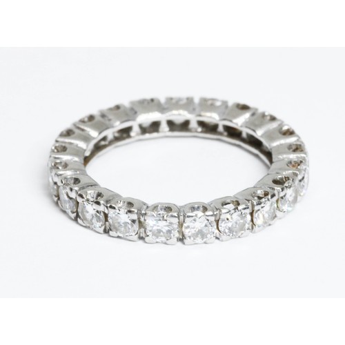 592 - A diamond eternity band, twenty one round brilliant cut diamonds weighing approximately 1.68cts in t... 