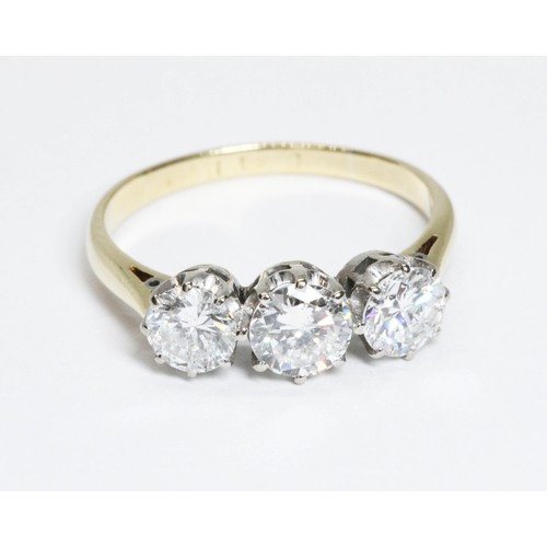 591 - A three stone diamond trilogy ring, the round brilliant cut stones weighing approximately 0.37, 0.48... 