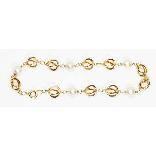 603 - A cultured pearl and fancy link bracelet, indistinctly marked, length 18cm, gross weight 6.3g.