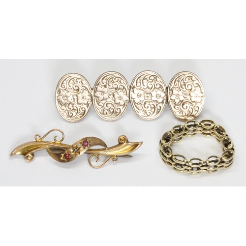 598 - A mixed lot of jewellery comprising a pair of 9ct gold cufflinks converted to brooch with base metal... 