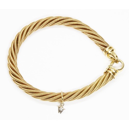 596 - BOODLES/WELLENDORF an 18ct yellow gold bracelet, of twisted wire design with diamond set Wellendorf ... 