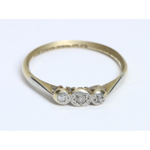 608 - A three stone diamond ring, the band marked '18ct PLAT', gross weight 1.7g, size M