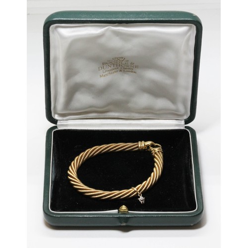 596 - BOODLES/WELLENDORF an 18ct yellow gold bracelet, of twisted wire design with diamond set Wellendorf ... 