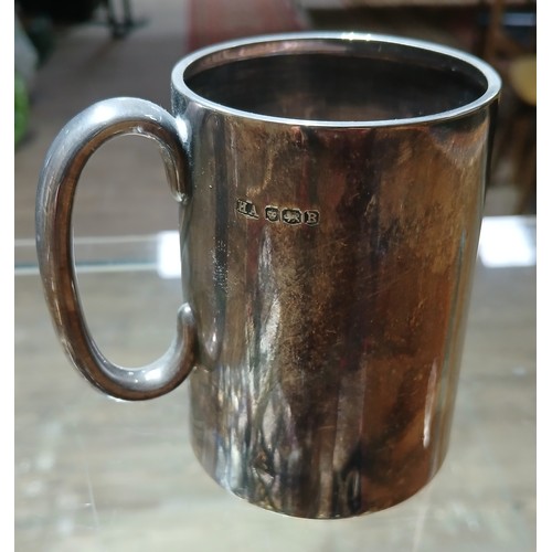 584 - A hallmarked silver christening tankard, height 8cm, weight 4.1ozt.