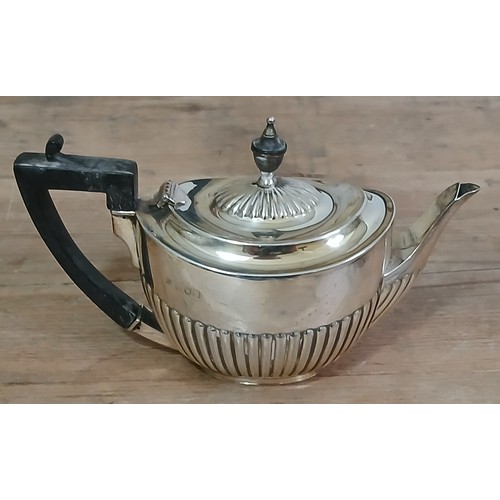 575 - A hallmarked silver bachelor's tea pot, gross weight 8ozt.