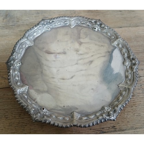 581 - A George II silver salver, rococo moulding and stood on three feet, Ebenezer Coker, London 1747, dia... 