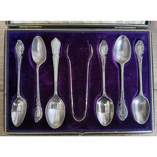 587 - A cased set of six hallmarked silver teaspoons and sugar tongs.