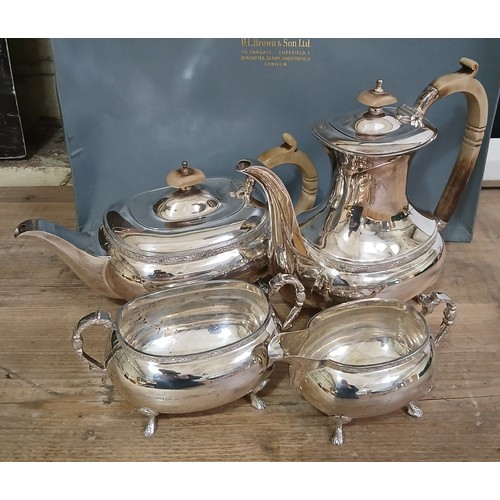 574 - An Elizabeth II silver tea set, carved wood handles and finials, H L Brown & Son, Sheffield 1973, gr... 