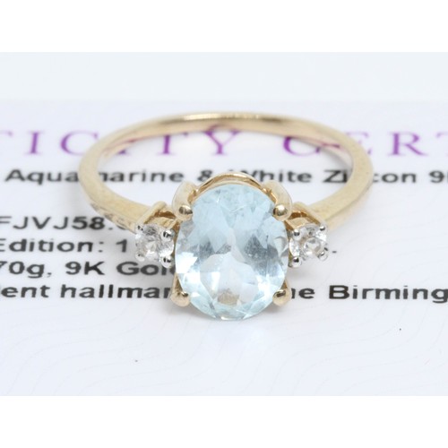 642 - A 9ct gold aquamarine and white zircon ring, gross weight 2g, size L, with Gemporia certificate.