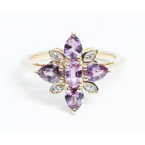 650 - A 9ct gold purple sapphire and colourless stone cluster ring, gross weight 2.5g, size J.