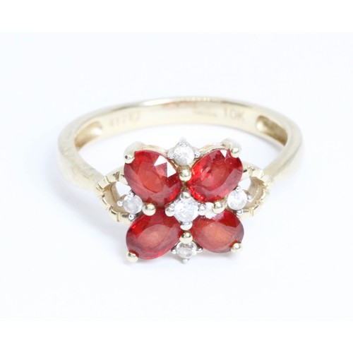 653 - A 9ct gold ruby and colourless stone cluster ring, gross weight 2g, size J.