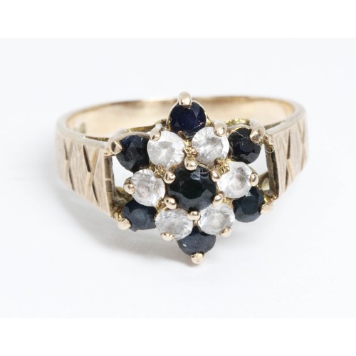 665 - A 9ct gold sapphire and colourless stone cluster ring, gross weight 3.4g, size M.