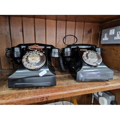 1 - Two black bakelite GPO telephones.