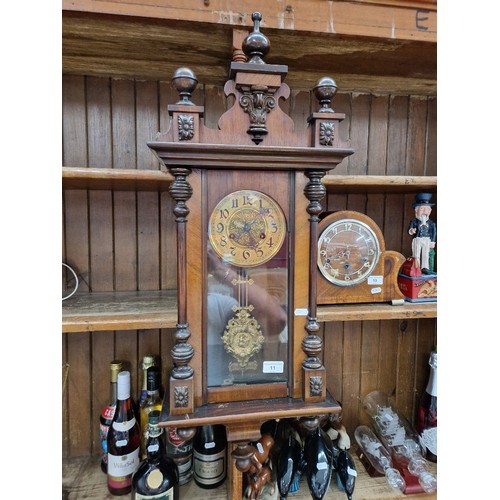 11 - Vienna wall clock with pendulum and key.