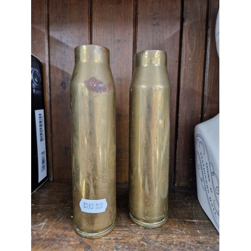 6 - A pair of brass shell cases.