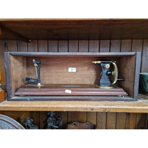 17 - A Goodbrand & Co brass thread strength tester, mounted on mahogany base with mahogany case.