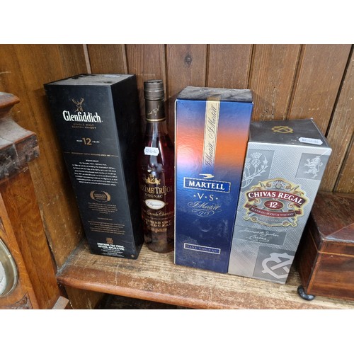 35 - Four bottles of alcohol; a Glenfiddich 12 year old single malt whisky, Chivas Regal 12 year old blen... 